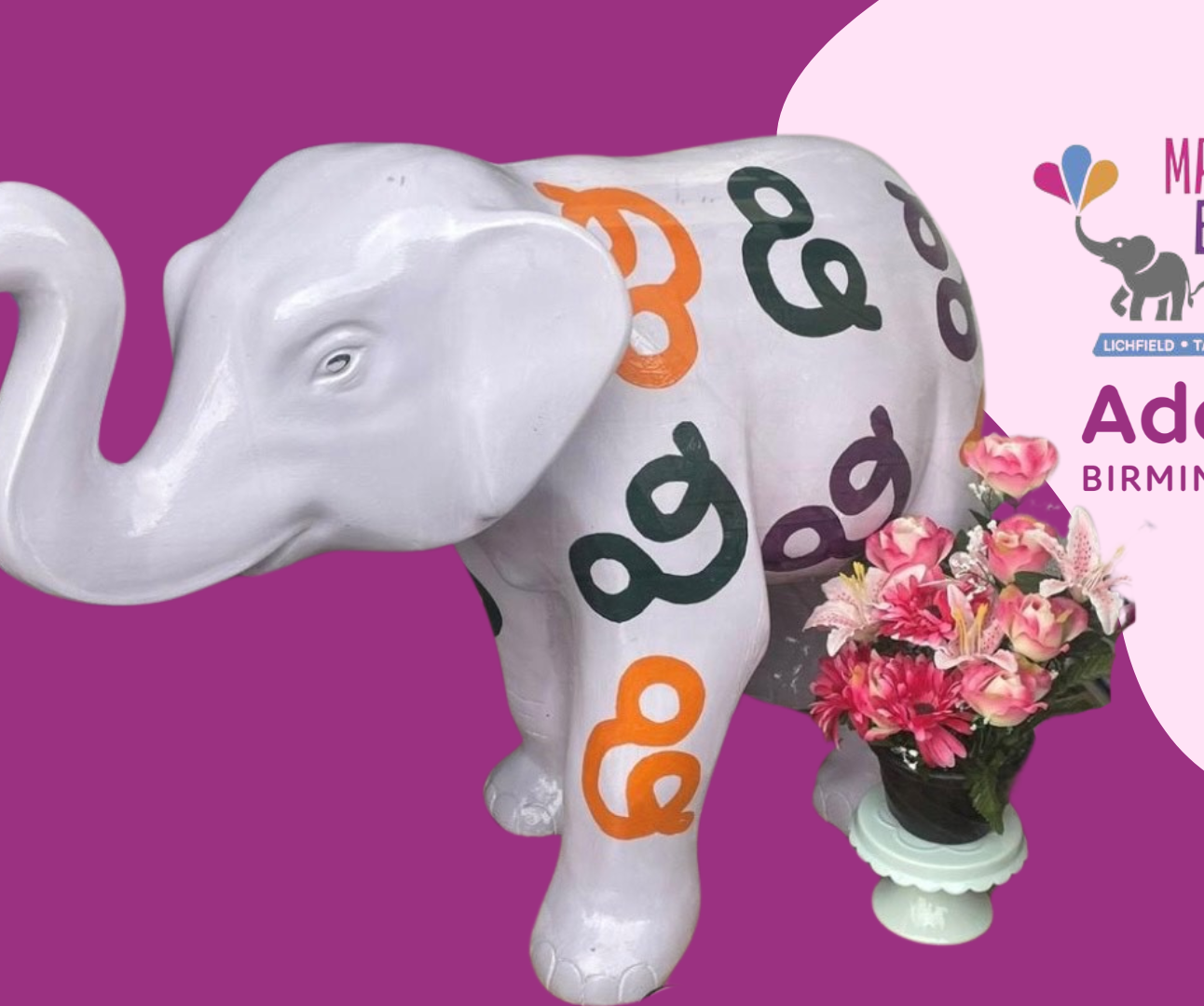 Photo of lilac elephant with pattern of ampersands in orange, purple and green